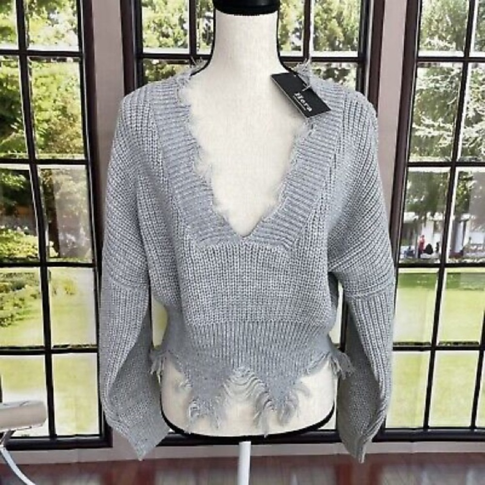 Grey distressed sweater with beautifully cinched waist